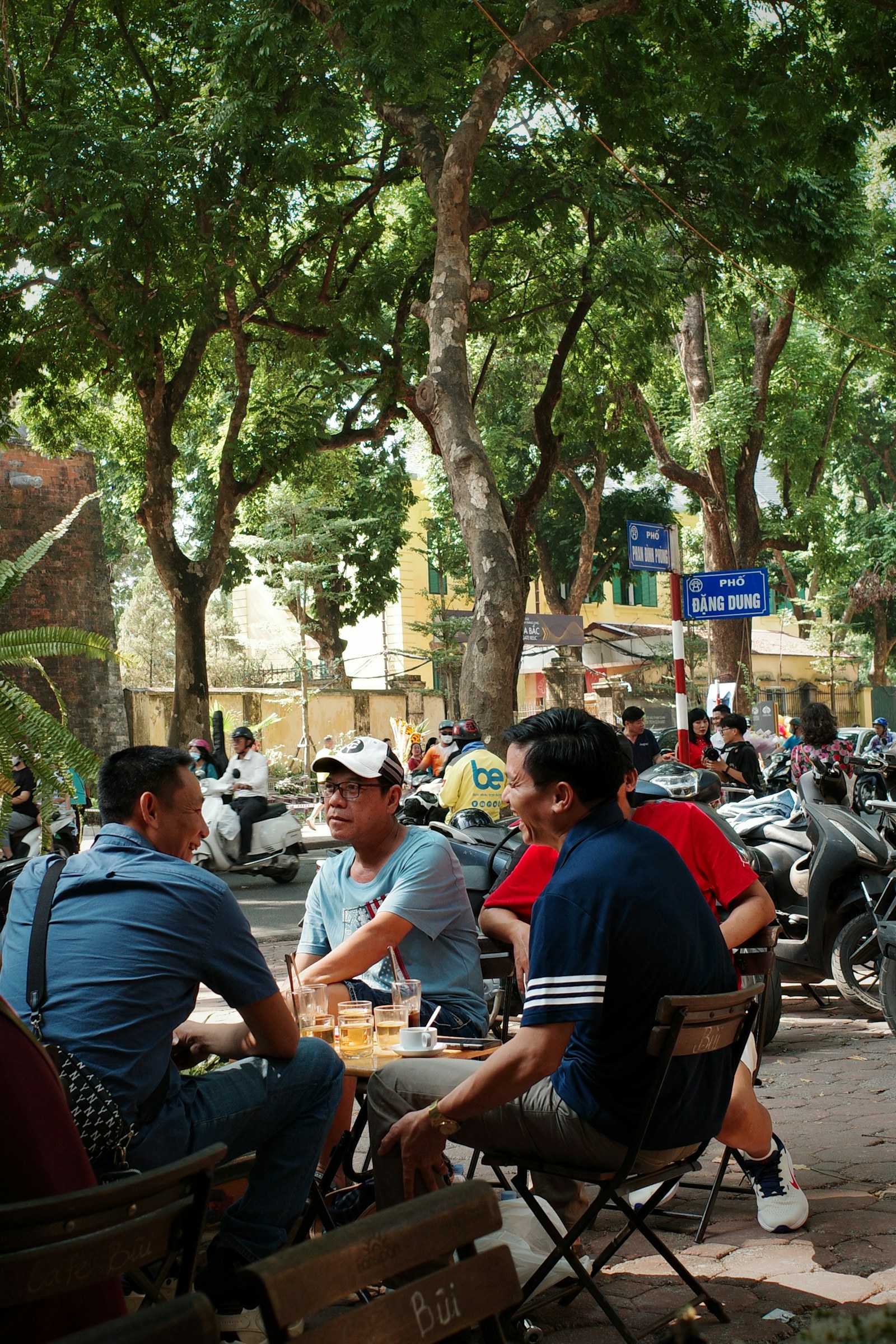 Friends meeting at a street café in Hanoi